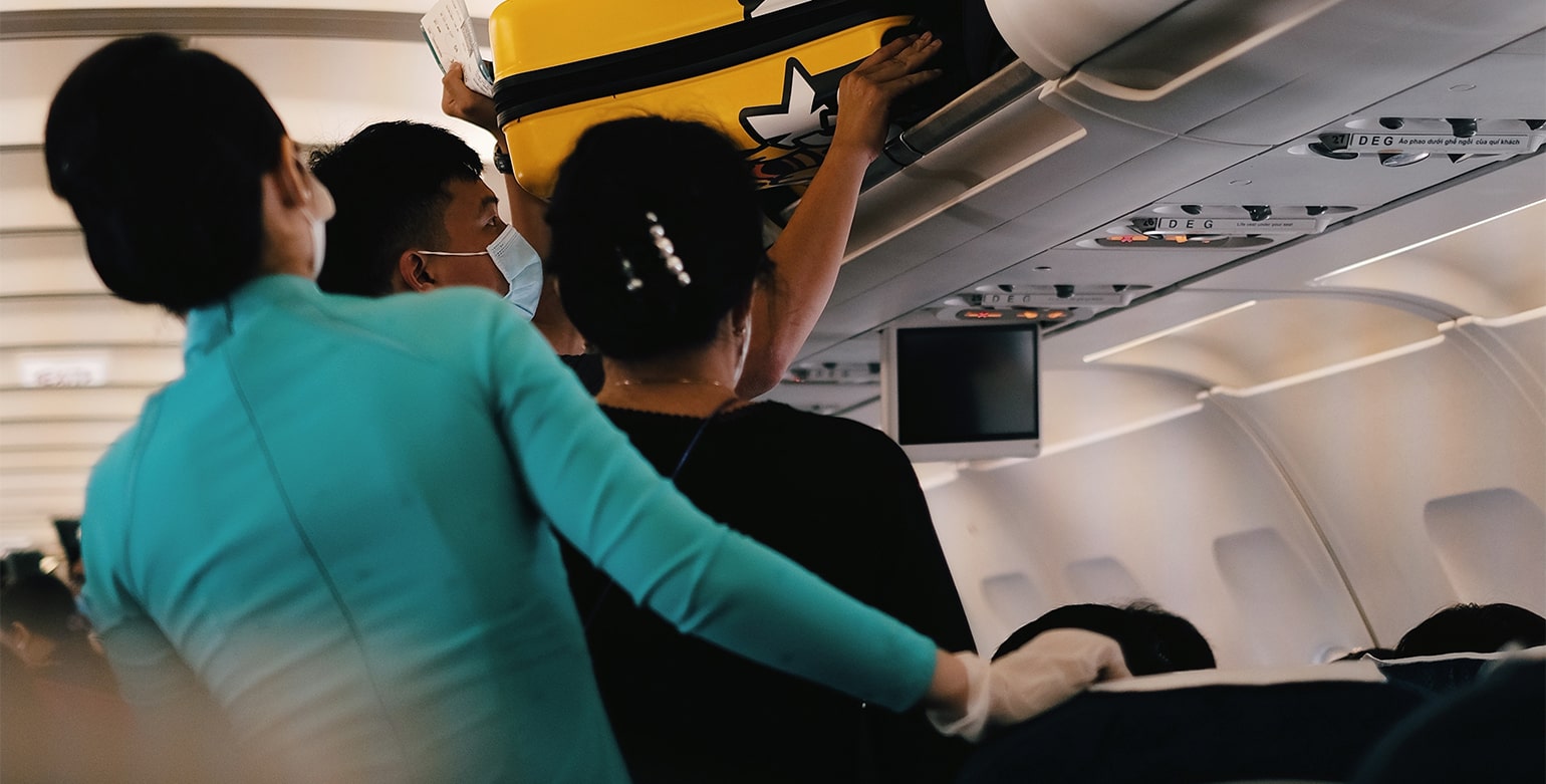 Why You Should Never Store Your Carry-On on a Plane Behind You